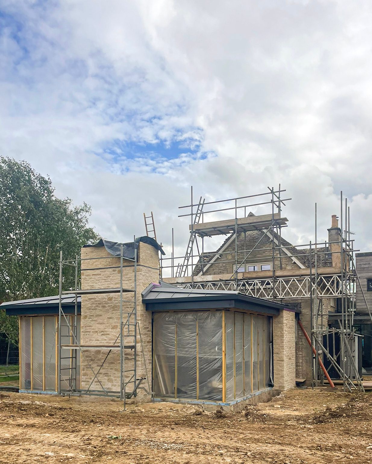 The Cirencester cottage extension with scaffolding down and the new roof revealed